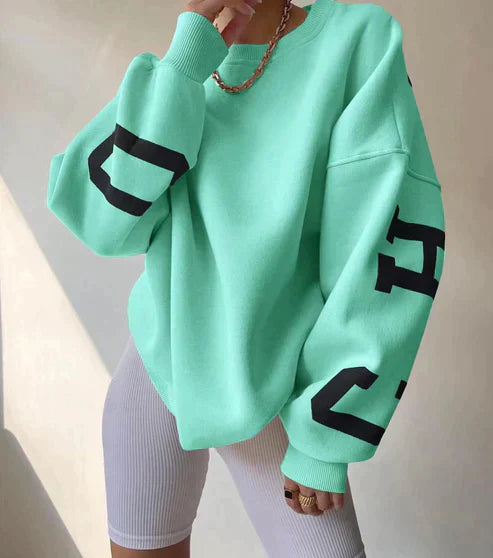 Damska Oversized Bluza – Komfortowy Krój – Okrągły Dekolt – Graficzne Rękawy – Styl Casual