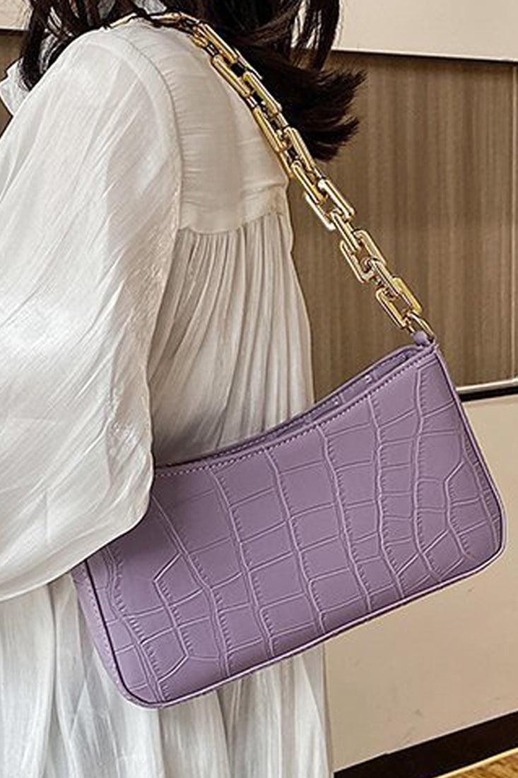 Torebka ręczna w purpurowy krokodyli wzór